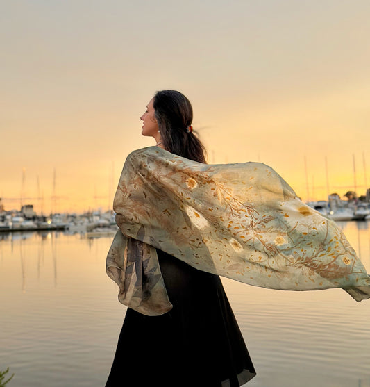 Eco-printed silk shawl in muted gray and blue tones with natural seaweed pattern